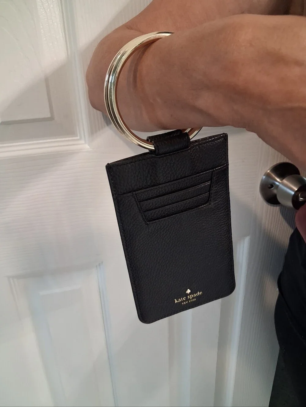 KATE SPADE BLACK with GOLD STUDS WRISTLET PHONE CASE & BL. & WH. STRIPES Inside